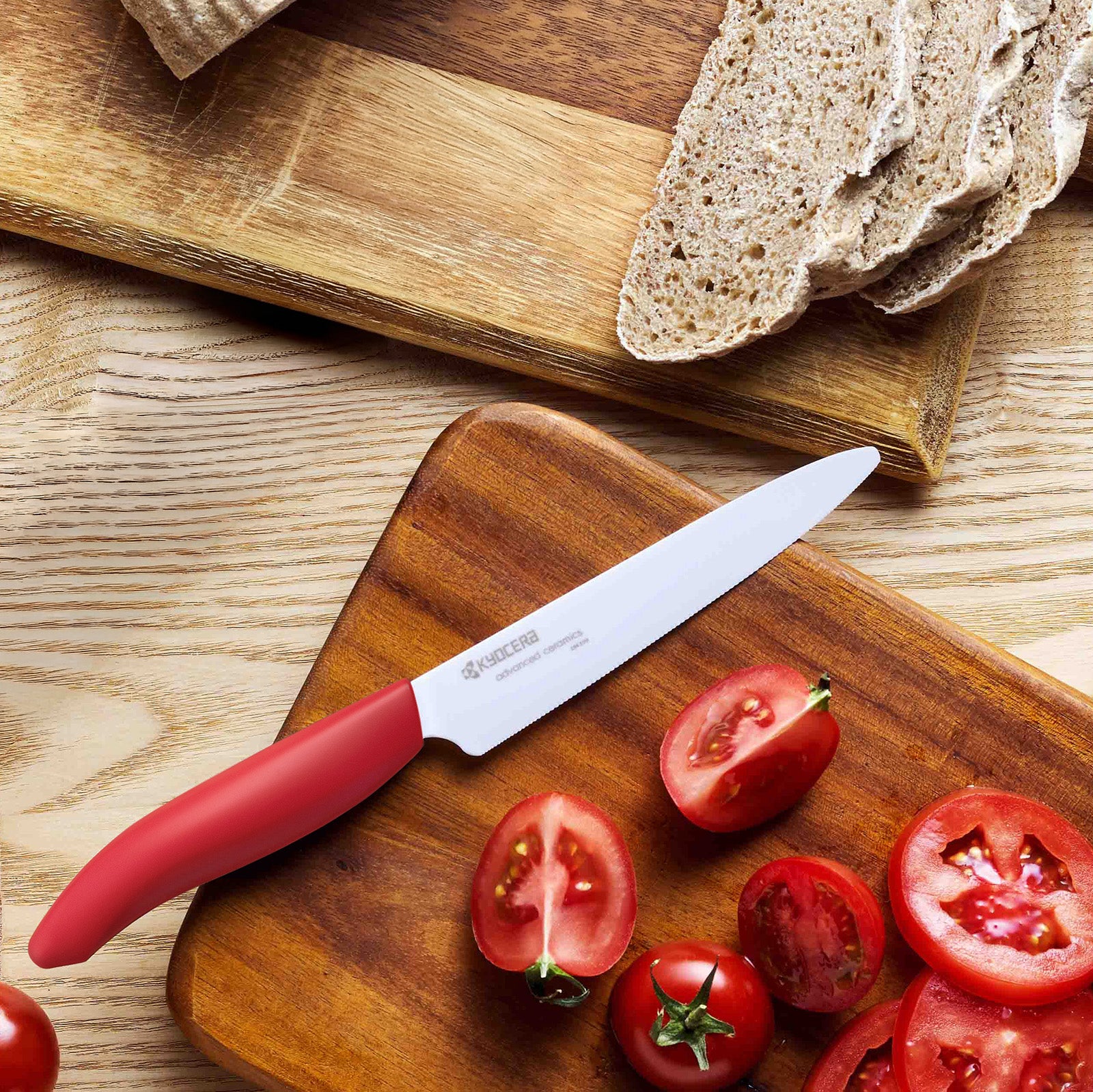 Kyocera Revolution Ceramic 5 Inch Micro Serrated Tomato Knife, Red